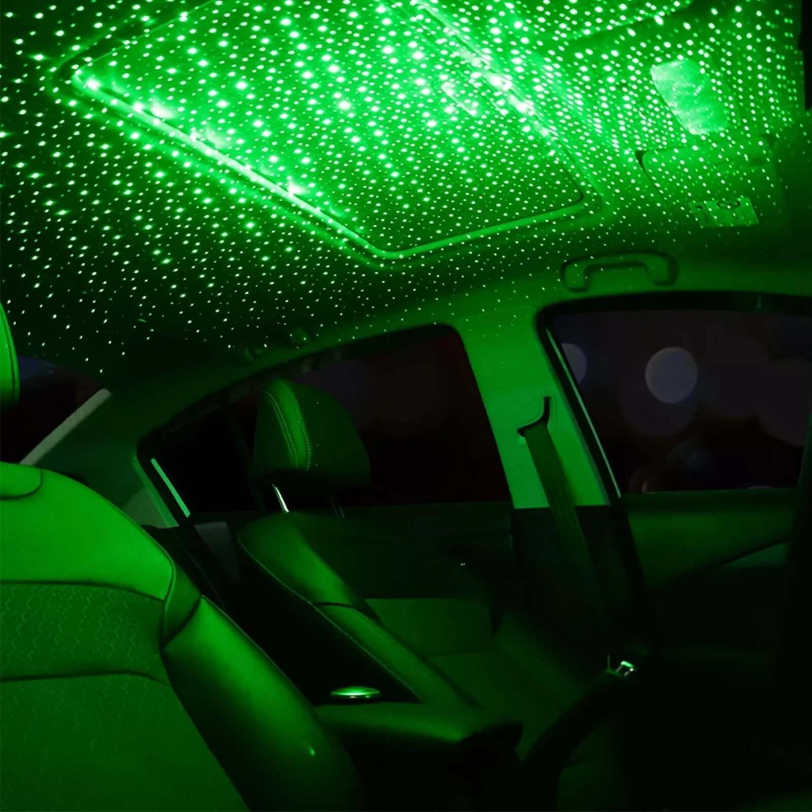 Interior view of a car lit with green star decoration lights creating a unique and romantic atmosphere.
